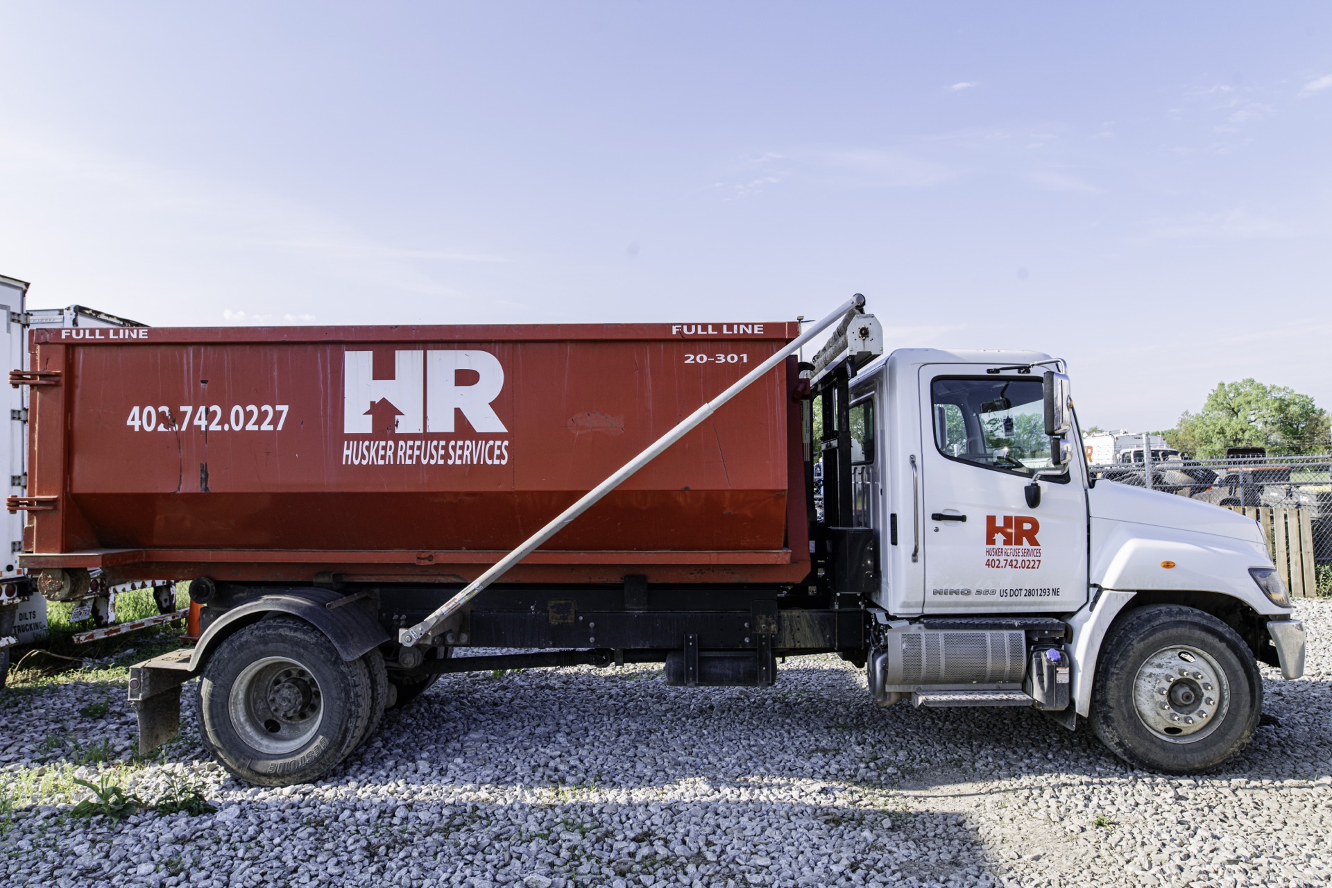 Roll-off dumpster being delivered