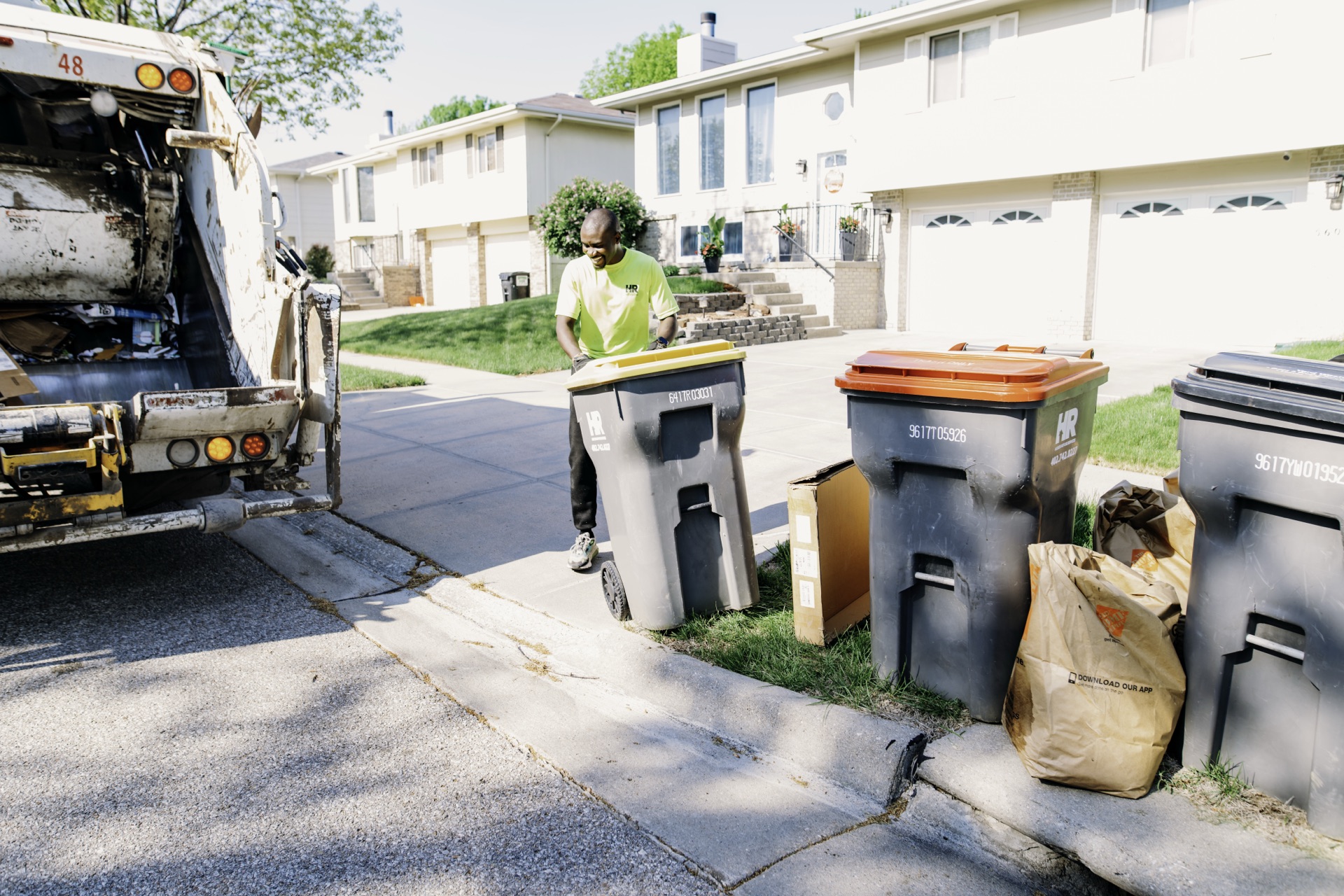 Husker Refuse collection cans with color-coded lids