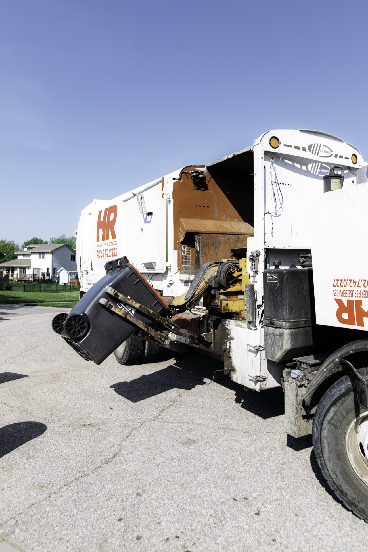 Husker Refuse yard waste collection truck