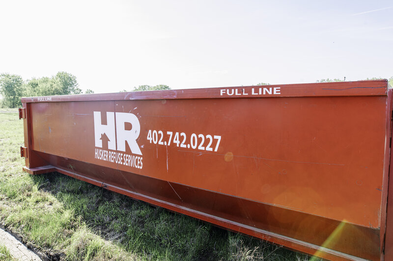 Husker Refuse truck and roll-off services