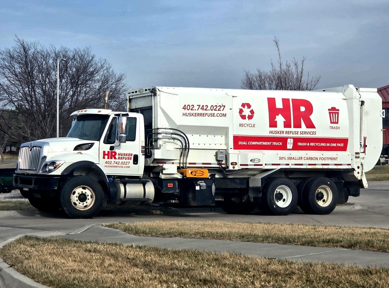 Husker Refuse dual-compartment truck — trash and recycling in one pass